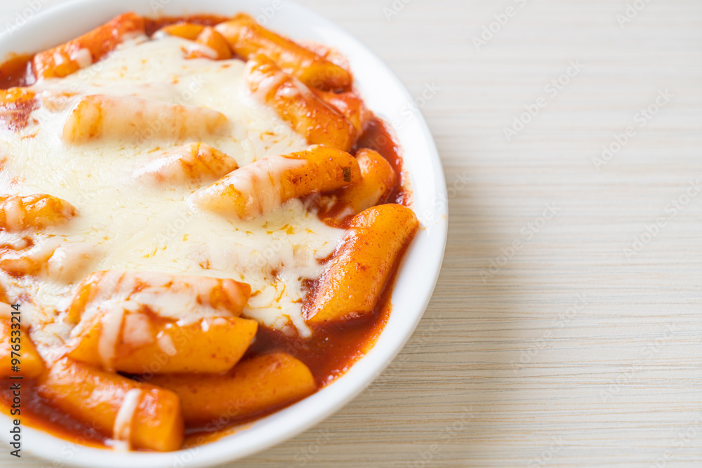 Korean rice cake in spicy Korean sauce with cheese, Cheese Tokpokki, Tteokbokki with Cheese Korean rice cake in spicy Korean sauce with cheese, Cheese Tokpokki, Tteokbokki with Cheese