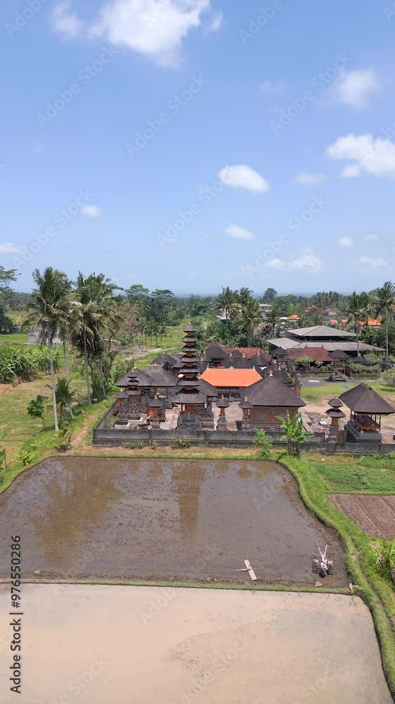 Aerial view of Balinese Hindu Temple and rice fields landscape in Ubud, Bali, Indonesia Aerial view of Balinese Hindu Temple and rice fields landscape in Ubud, Bali, Indonesia