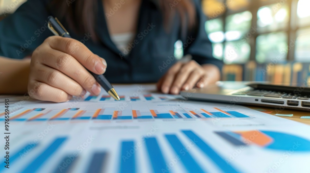 A business professional reviewing market analysis and planning for expansion. A business professional reviewing market analysis and planning for expansion.