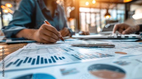 A middle market business owner reviewing financial reports with a team