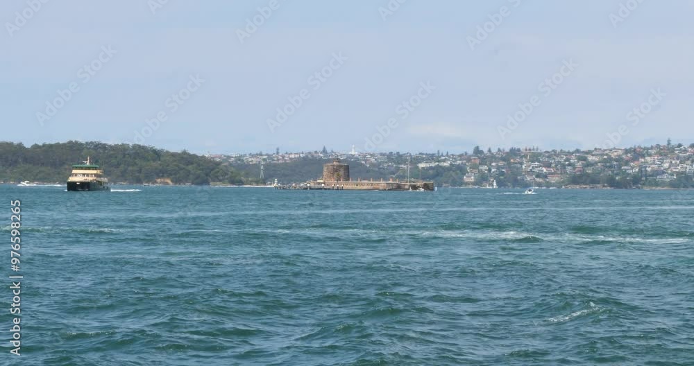 Fort Denison part of the Sydney Harbour National Park, Pinchgut Island, Sydney, Australia.Ferry Boats passing around the Fort Denison. Fort Denison part of the Sydney Harbour National Park, Pinchgut Island, Sydney, Australia.Ferry Boats passing around the Fort Denison.