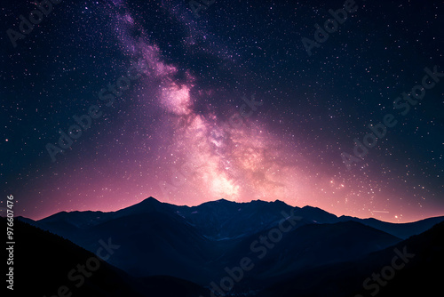 A stunning view of the night sky with a majestic mountain range in the foreground.