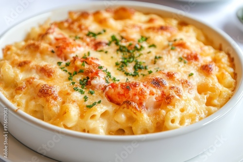 A close-up shot of a creamy lobster mac and cheese dish, showcasing the rich, cheesy sauce, tender lobster meat, and a sprinkle of fresh parsley. This comforting dish is a perfect combination of flavo photo