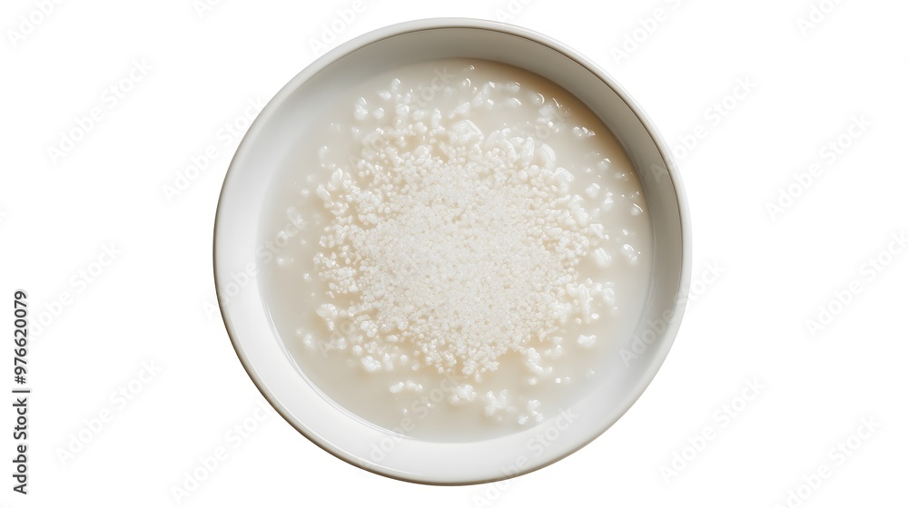 Plain fermented rice porridge in a white bowl on a white background Plain fermented rice porridge in a white bowl on a white background