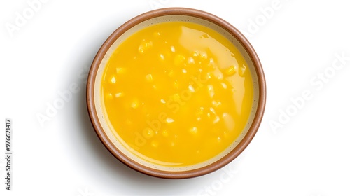 Delicious creamy corn soup in a rustic bowl on white background