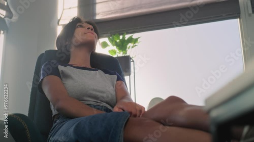 Wallpaper Mural Frustrated African American teenage girl sits in chair, discusses family problems and psychological trauma with therapist. Depressed teenager during counseling session. Psychology concept. Slow Motion Torontodigital.ca