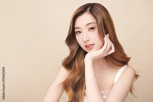 Beautiful young asian woman with clean fresh skin on beige background, Face care, Facial treatment, Cosmetology, beauty and spa, Asian women portrait.