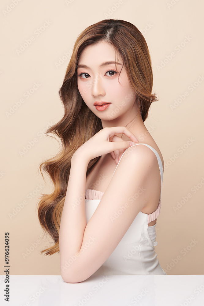 Fototapeta premium Beautiful young asian woman with clean fresh skin on beige background, Face care, Facial treatment, Cosmetology, beauty and spa, Asian women portrait.