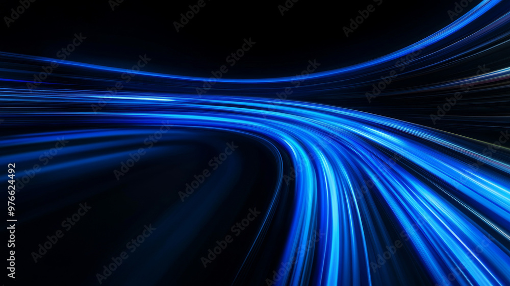 Blue light streaks racing across a black backdrop, creating a sense of speed and motion. Blue light streaks racing across a black backdrop, creating a sense of speed and motion.