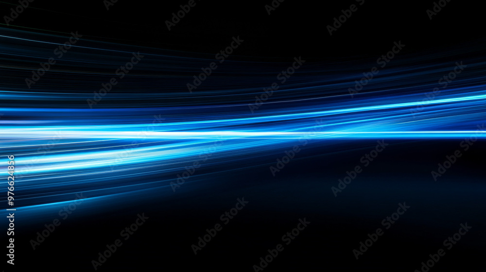 Blue light streaks racing across a black backdrop, creating a sense of speed and motion. Blue light streaks racing across a black backdrop, creating a sense of speed and motion.