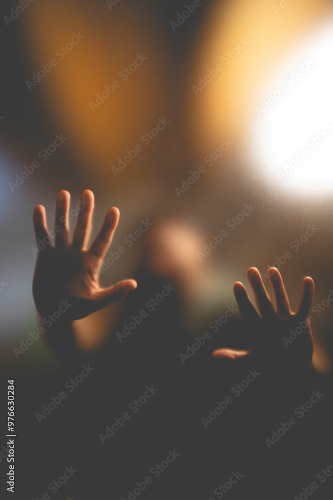 Scary picture of hands behind glass, horror ghost behind door, Halloween concept Scary picture of hands behind glass, horror ghost behind door, Halloween concept
