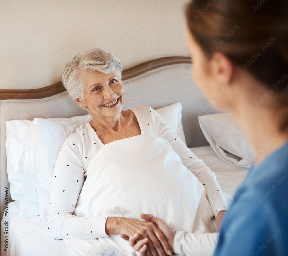 Fototapeta premium Nurse, elderly woman and holding hands in bed, support and kind with news of recovery in home. Caregiver, homecare and listen to medical consulting, senior person and patient for results on illness