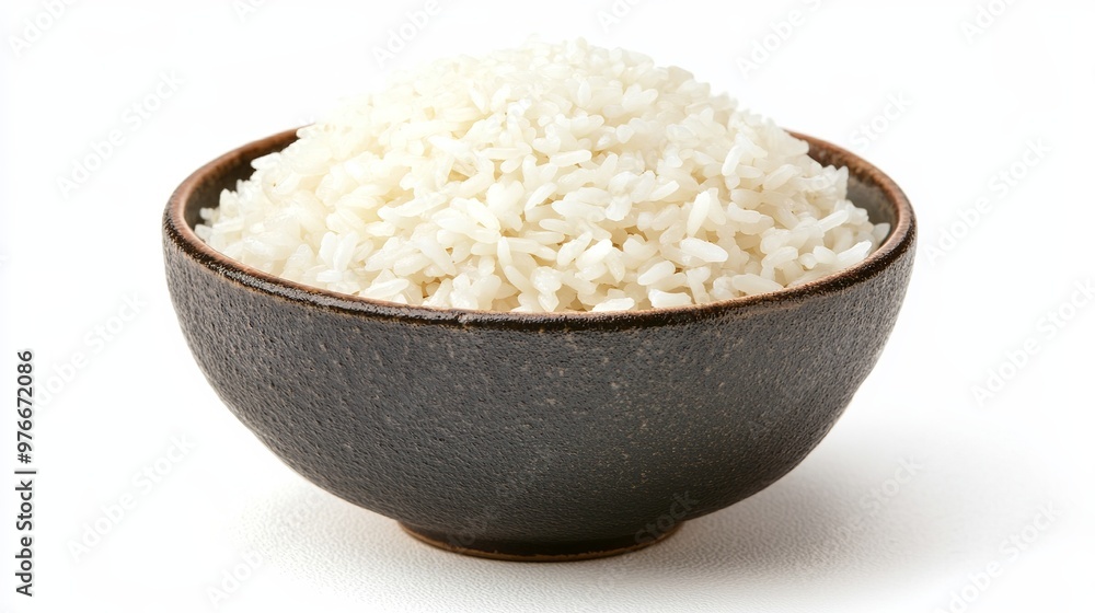 A bowl full of rice placed against a white background, highlighting the simplicity and purity of the dish. The white rice contrasts with the clean, neutral backdrop. A bowl full of rice placed against a white background, highlighting the simplicity and purity of the dish. The white rice contrasts with the clean, neutral backdrop.