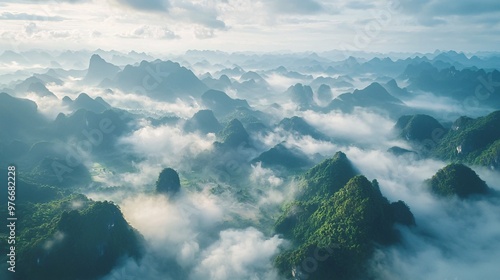 Bird's-eye perspective of limestone peaks amidst a stunning sky of clouds.