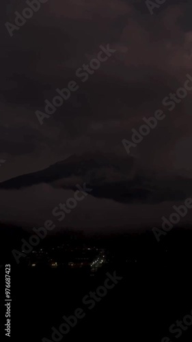 mountains covered in clouds towards evening