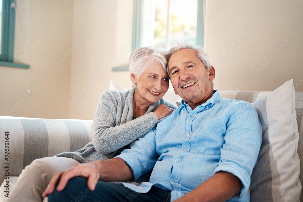 Smile, portrait and senior couple on sofa for connection, bonding and relaxing together at home. Happy, love and elderly man and woman hugging for resting in living room at house in Switzerland. Smile, portrait and senior couple on sofa for connection, bonding and relaxing together at home. Happy, love and elderly man and woman hugging for resting in living room at house in Switzerland.