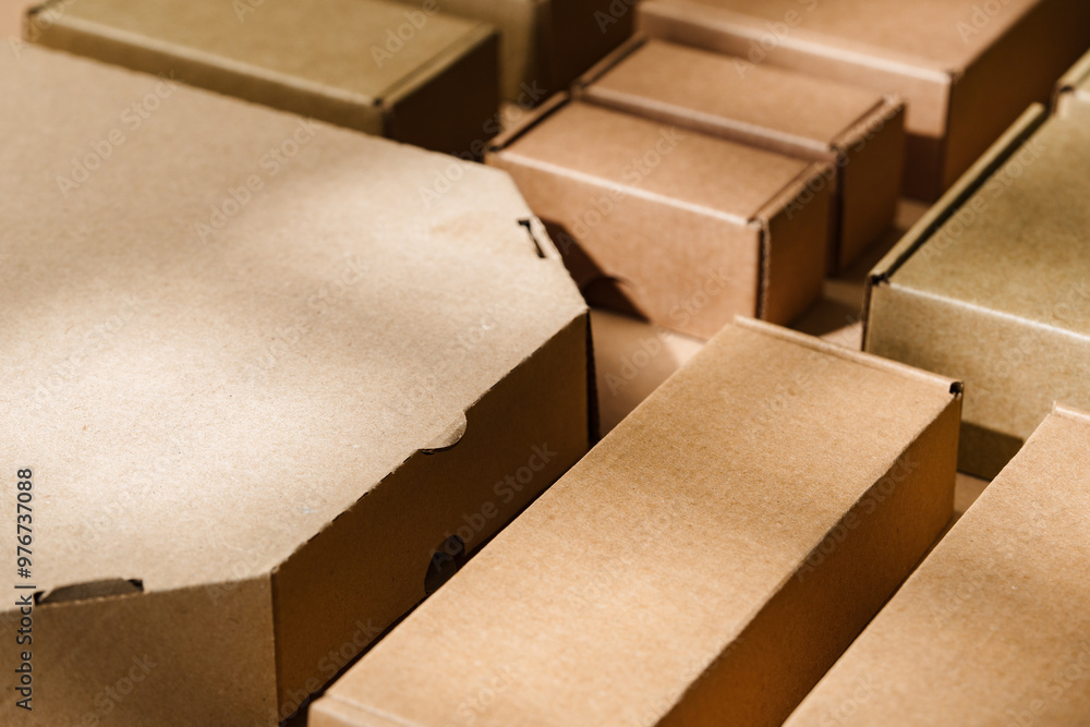 Multiple cardboard boxes arranged on a surface for packaging and shipping in a warehouse setting Multiple cardboard boxes arranged on a surface for packaging and shipping in a warehouse setting