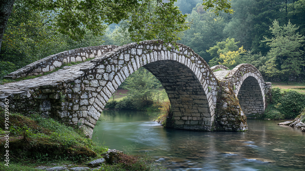 An ancient stone bridge with historic design and scenic surroundings. An ancient stone bridge with historic design and scenic surroundings.