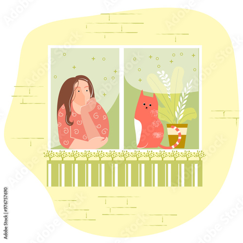 A girl with a cat looks out of the window. She is bored, dreaming, or waiting.