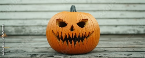 Spooky jack-o'-lantern with jagged teeth and menacing expression, perfect for Halloween decorations and autumn occasions.