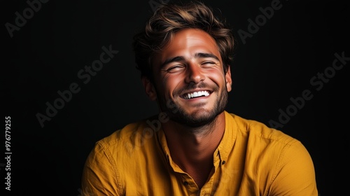 Portrait of a happy handsome man in a shirt with laughing