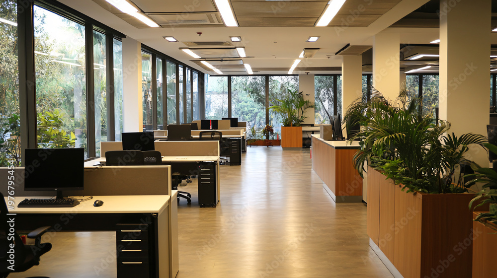 A spacious office with large windows, comfortable workstations, and a productive atmosphere. A spacious office with large windows, comfortable workstations, and a productive atmosphere.