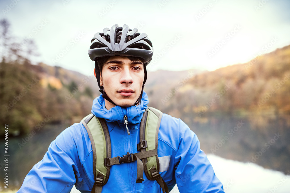 Portrait of cyclist in the middle of beautiful nature, early autumn morning. Concept of healthy lifestyle. Portrait of cyclist in the middle of beautiful nature, early autumn morning. Concept of healthy lifestyle.