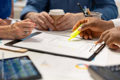 Financial planner expert highlighting contract terms for a detailed retirement plan, counseling about income and life savings to secure the future. Adviser helps old people. Close up. photo