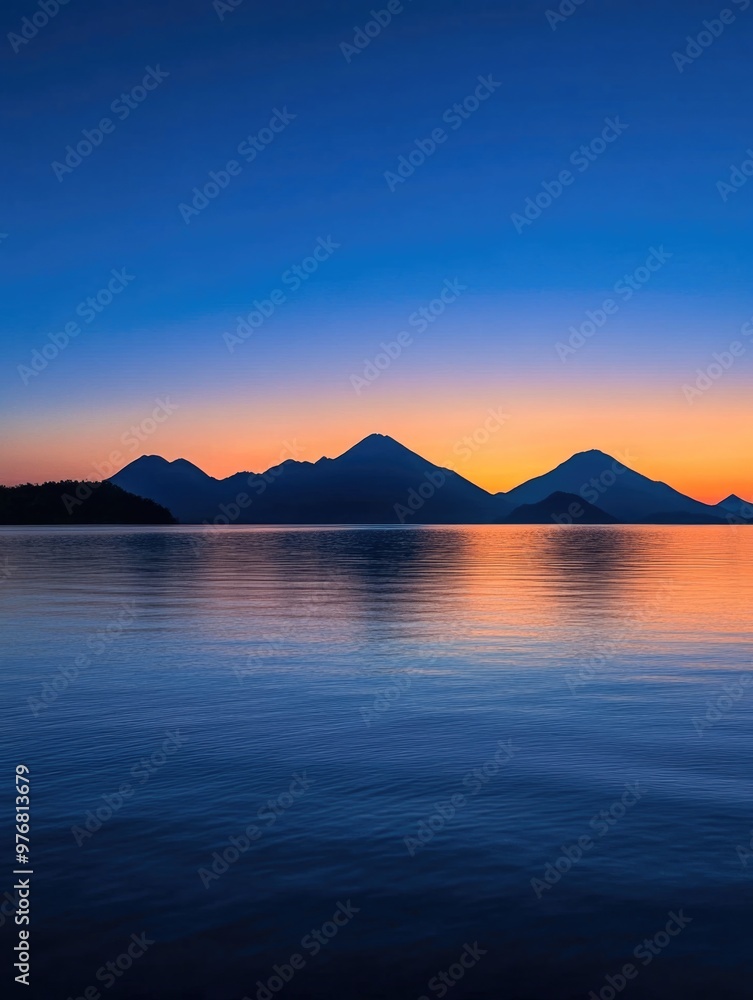 Sunset over mountains and water Sunset over mountains and water