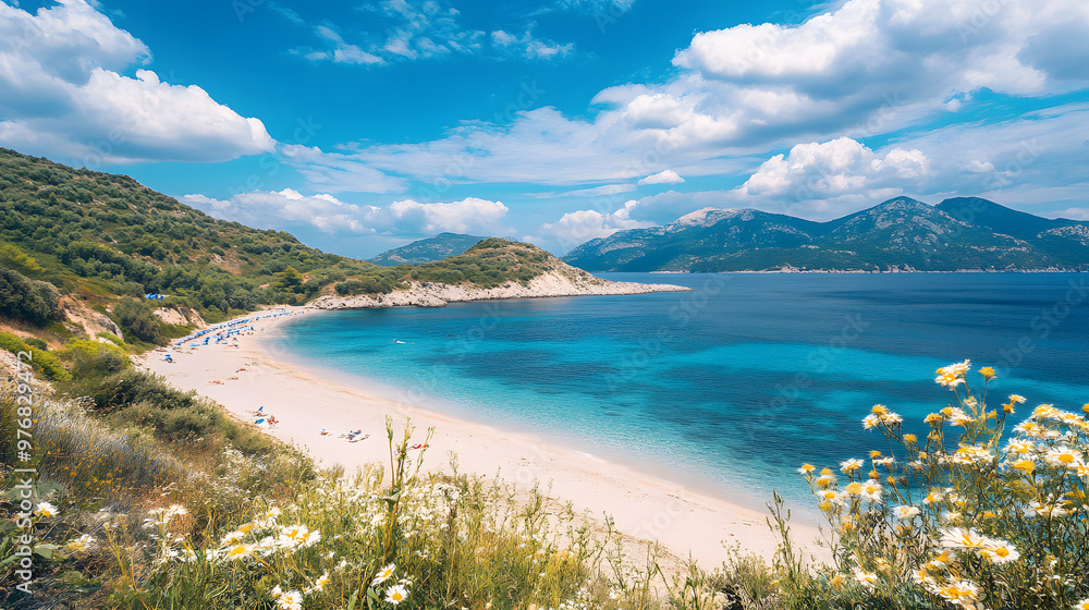 Fototapeta premium Crystal-clear turquoise water laps against the golden sand, framed by lush tropical greenery and a vibrant blue sky