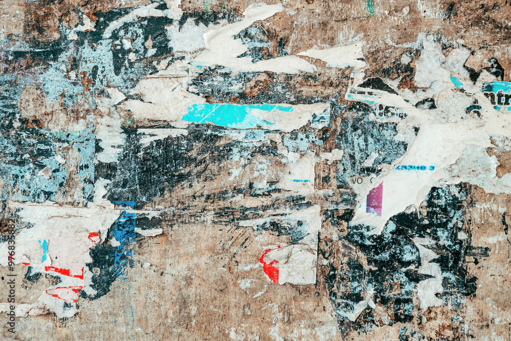 Fototapeta premium Torn ripped poster paper texture on concrete wall