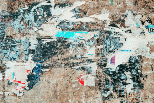 Torn ripped poster paper texture on concrete wall