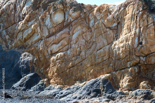 old coast rock in the sunlight photo