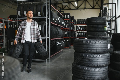 A male customer in a car tire shop