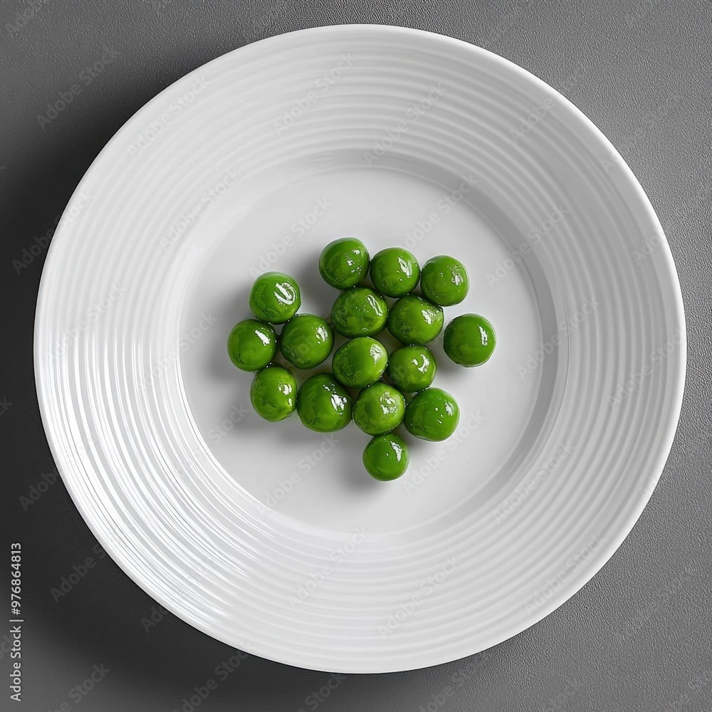 A creative arrangement of vibrant green peas on a minimalist white plate for an elegant meal A creative arrangement of vibrant green peas on a minimalist white plate for an elegant meal