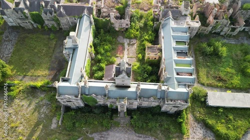 Haunted Denbigh Lunatic Asylum, North Wales, aerial dronie revealing site, sunny afternoon photo