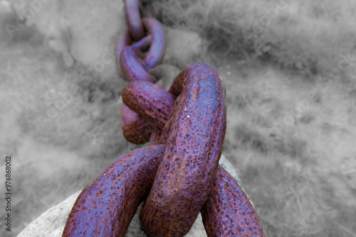 close-up of a rusty and tired chain photo