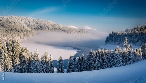 Winter fog rolling over a snowy lake
