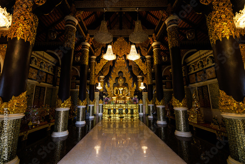 Buddha statue in the temple and sculpture patterns at Wat Phra That Doi Phra Chan Mae Tha, Lampang province Thailand photo