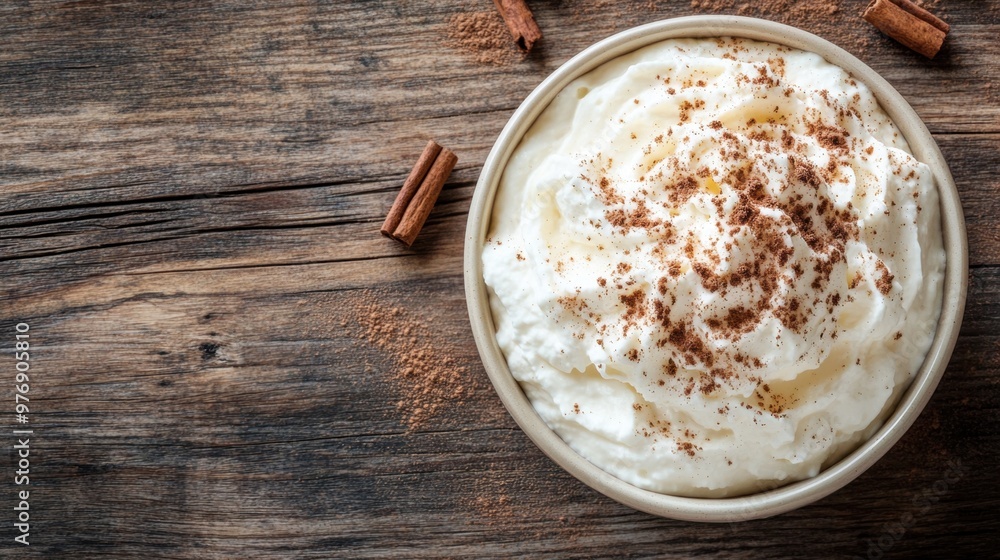 whipped ricotta on a wooden table with cinnamon, a tasty breakfast idea whipped ricotta on a wooden table with cinnamon, a tasty breakfast idea