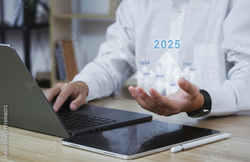 Hand holding the modern and digital globe with 2025 new year on modern background, Digital transformation trend in 2025, Technology trend