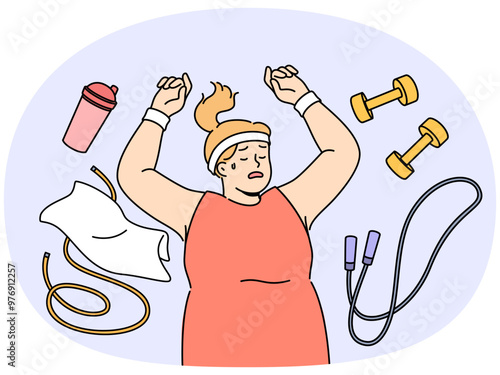 Fat woman lies on floor among fitness accessories, falling asleep after workout and dreaming of getting rid of overweight. Lazy girl does not want to go in for sports and fight overweight