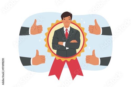 Man became best employee of month, looking out from medal located among fingers up. Guy best employee of month, stands with arms crossed and feels confident or ready for professional challenges.