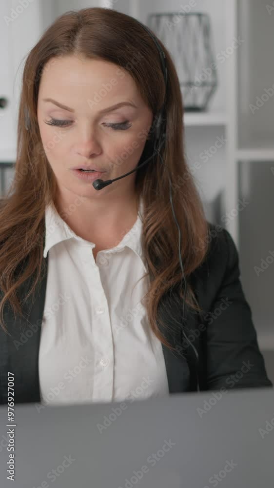 An experienced businesswoman, seen in a contemporary office environment while using a headset, underlines the importance of digital skills and corporate communication in the workplace An experienced businesswoman, seen in a contemporary office environment while using a headset, underlines the importance of digital skills and corporate communication in the workplace