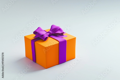 Orange colored gift box with a purple bow on an white background. Halloween style gift box. 