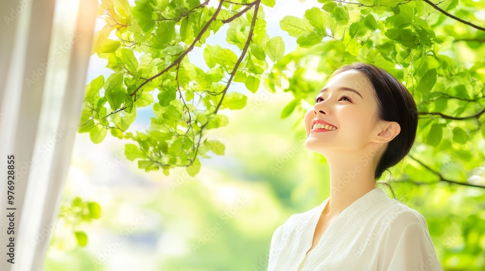A calm and peaceful person standing amidst a background of bright green leaves, representing harmony with nature. A calm and peaceful person standing amidst a background of bright green leaves, representing harmony with nature.