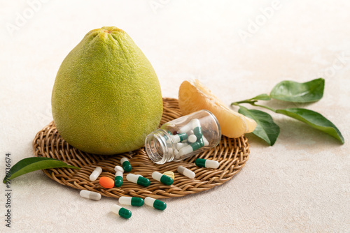 Fresh pomelo fruit and medicine adverse drug reaction interaction design concept.