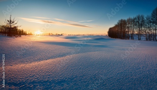 Winter evening over snow-covered field