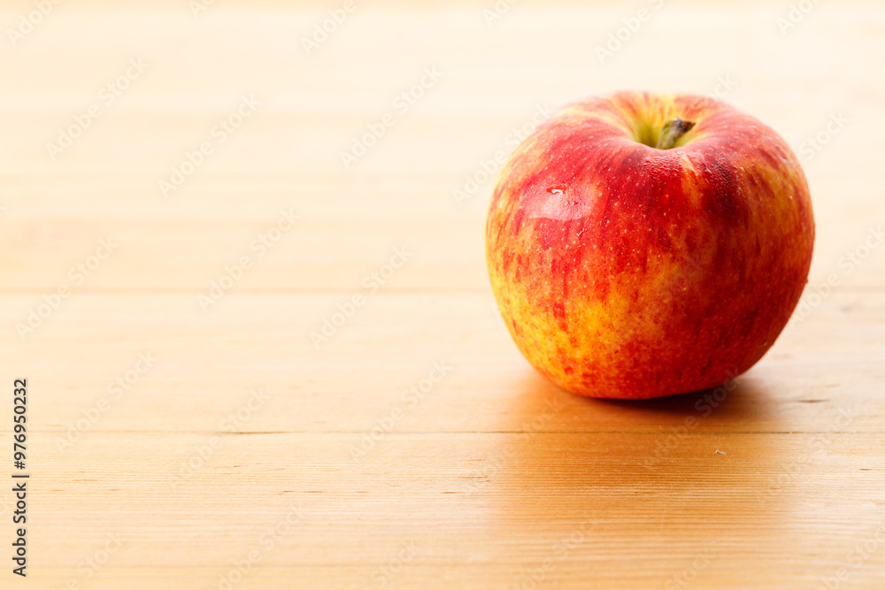 Ripe organic red apple on wooden table background. Ripe organic red apple on wooden table background.