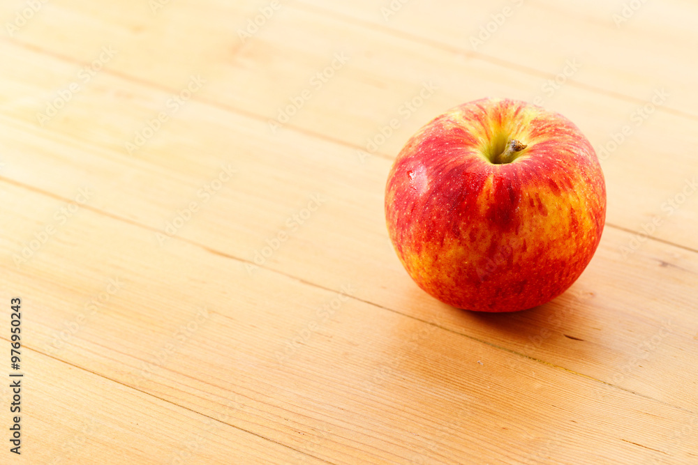 Ripe organic red apple on wooden table background. Ripe organic red apple on wooden table background.